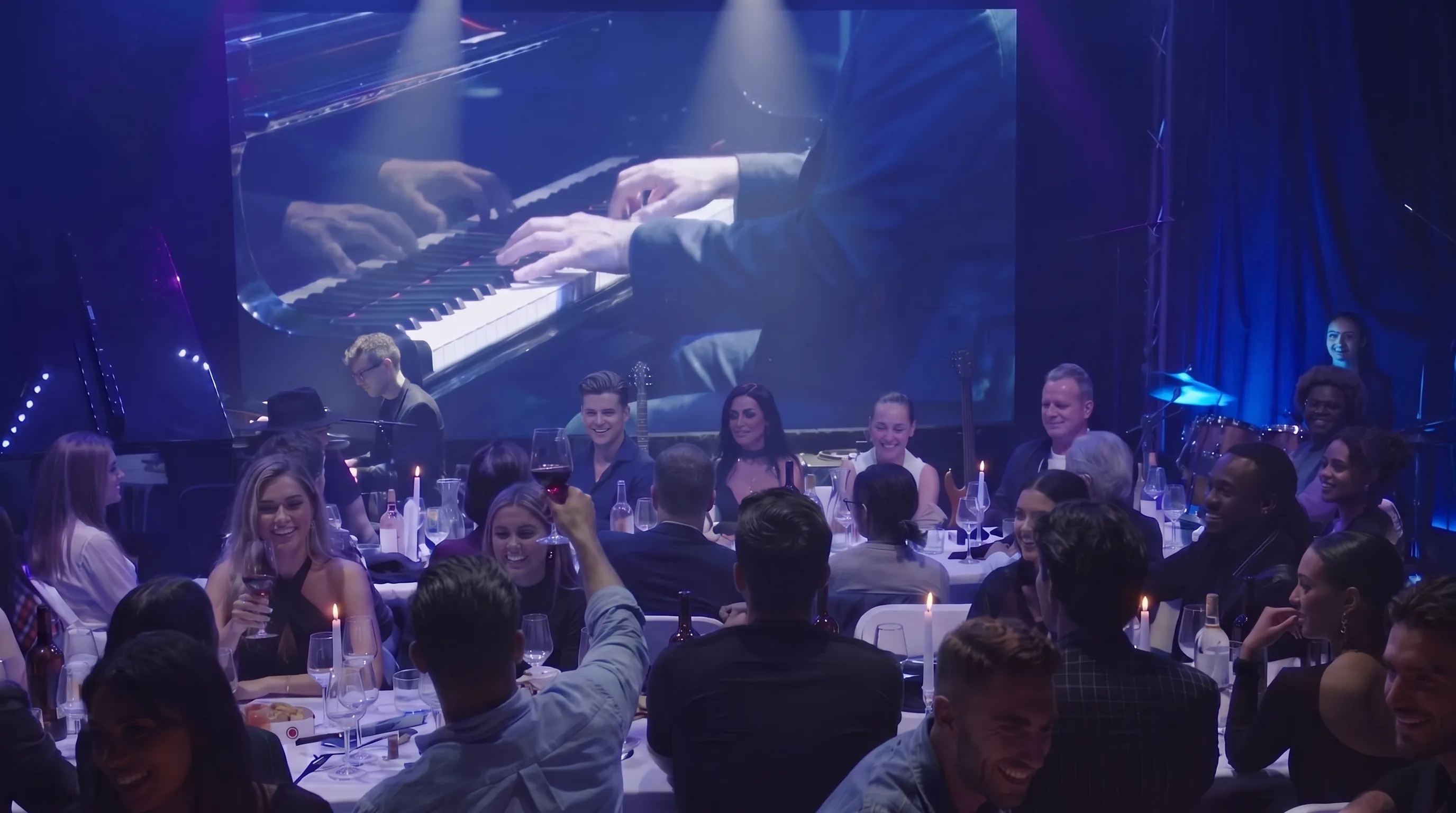 The live room full for a show, the LED wall above the stage